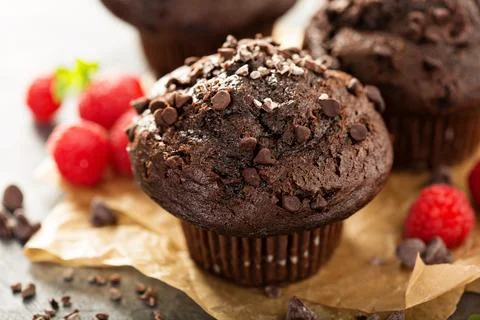 Double chocolate muffins with raspberry Stock Photos