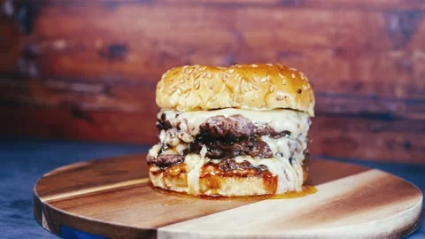Double Deck Cheese Burger on Rustic Board Stock Footage 323468357