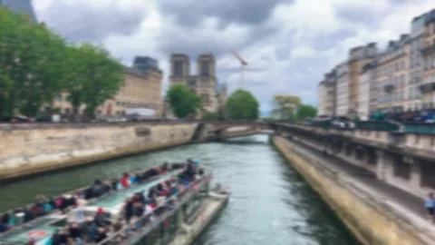 A double-deck ferry carrying tourists sails down the Seine River. Stock Footage 319431583