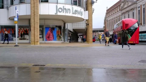Double Deck Red Bus And People Passing A John Lewis Store Video stock 162612353