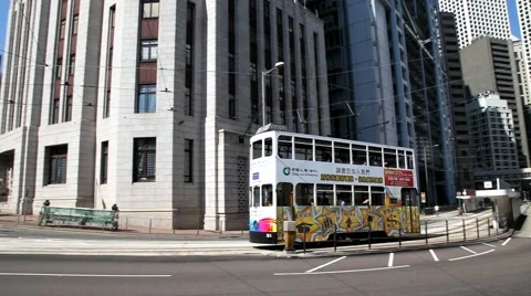 Double-deck tram passes by the street of Hong Kong, China. Stock-Footage 58409476