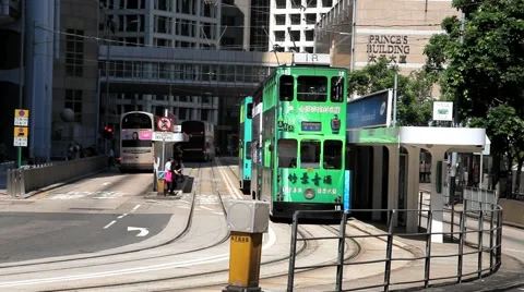Double-deck tram passes by the street of Hong Kong, China. Stock Footage 58409642