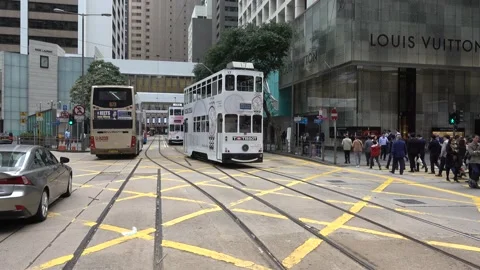 Double-deck trams in Hong Kong are one of the most popular ways Stock Footage 138062872