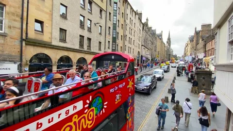 Double-decker bus and tourists to Edinburgh, Scotland Stock Footage 220633692