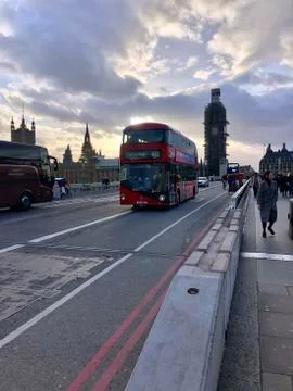Double-decker bus at sunset on the bridge against the backdrop of Big Ben UK Fotos Stock