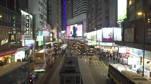Double decker buses and pedestrians on night city street Stock Footage 164824899