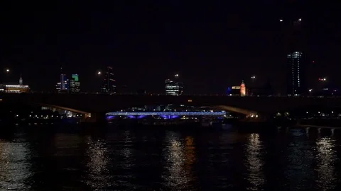 Double-decker busses cross River Thames sat night, London Stock Footage 122346874