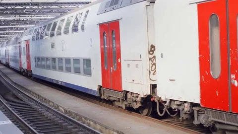 Double-decker international train is at platform of railroad station of Brussels Stock Footage 82323868