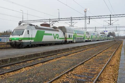 Double-decker passenger train at the platform of the Joensuu railway station Stock Photos