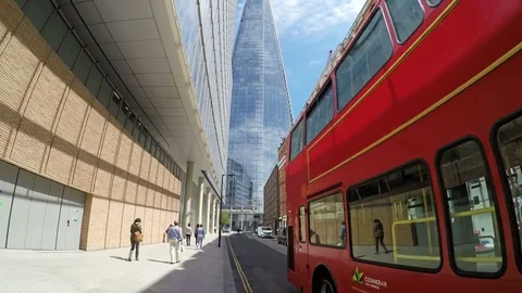 Double-decker passing in front of The Shard in London Stock Footage 78872348