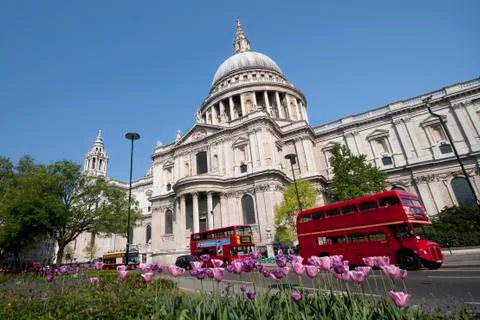 Double decker passing by front of st paul's cathedral. summer sky for copy sp Stock Photos