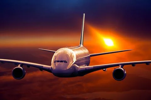 Double decker plane flying on a high altitude during the sunset Stock Photos