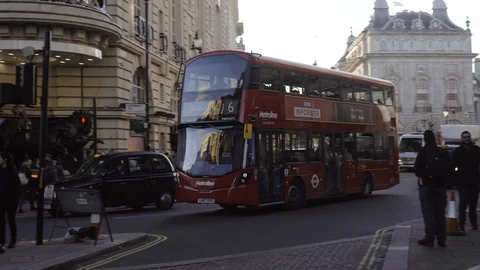 Double decker red bus driving on oxford circus London streets traffic Stock Footage 101428570