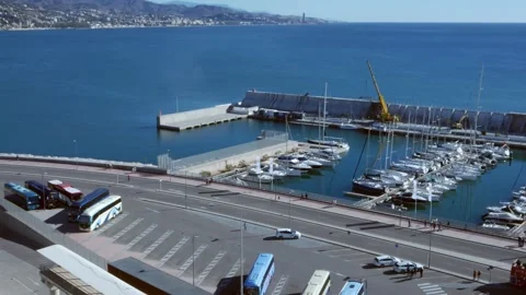 Double decker tourist bus arriving at Malaga's cruise terminal Stock Footage 258763430