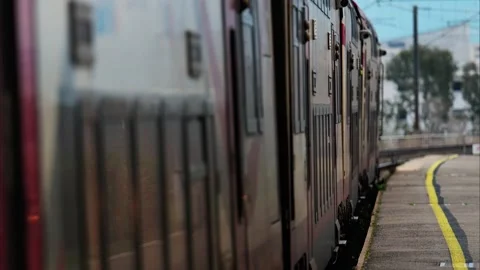 A double-decker train departing from station in motion, cinematic view of u.. Stock Footage 339343923