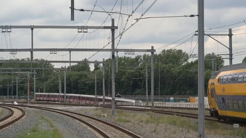 Double decker train with passengers passing Stock Footage 110017943