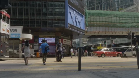 Double decker tram approach the stop in Hong Kong Stock Footage 127507071
