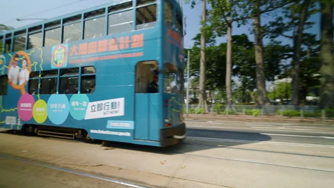 Double-decker Tram - Ding Ding In Hong Kong. - tracking shot Stock Footage 336434869