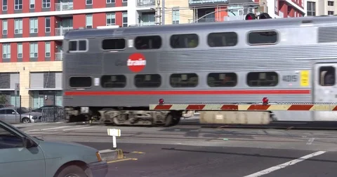 Double decker tram driving on city street Stock Footage 84515213