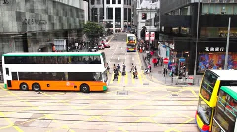 Double-decker trams and buses at Des Voeux Road. 動画素材 21893542
