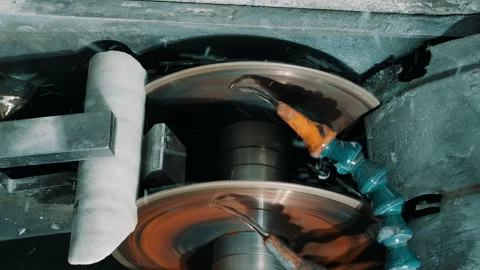 Double-Disc Grinding Machine with Coolant Spray in Metalworking Workshop Stock Footage 337927312
