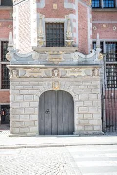 Double doors with decorative elements and artificial masonry and gilding Stock Photos