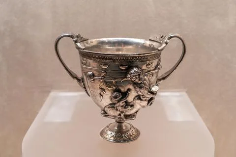 Double eared wine glasses adorned with centaurs and little love gods uneart.. Stock Photos