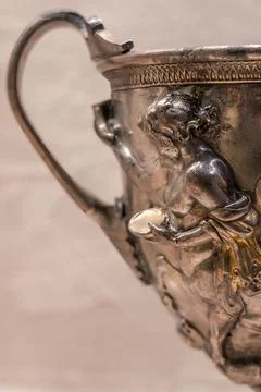 Double eared wine glasses adorned with centaurs and little love gods uneart.. Stock Photos