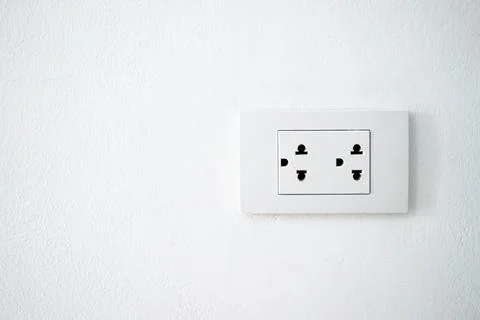 Double electrical outlet on the white wall. Stock Photos