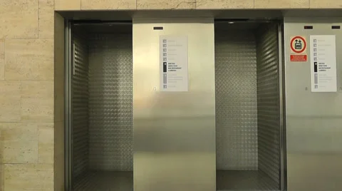 Double Elevator Doors closing Stock Footage 30735240