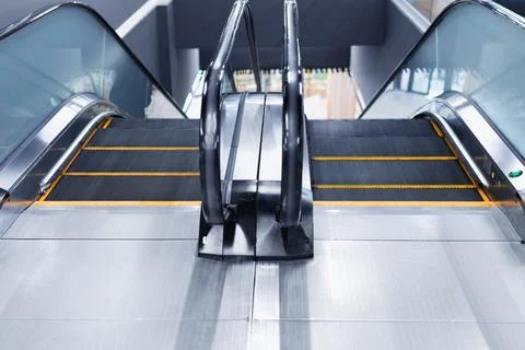 Double escalator with opposite direction in the interior of a public building Stock Photos
