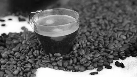 Double Espresso in a bath of Coffee Beans and Sugar Stock Photos
