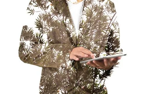 Double Exposure of Business Man using Mobile Tablet PC with Plant Stock Photos