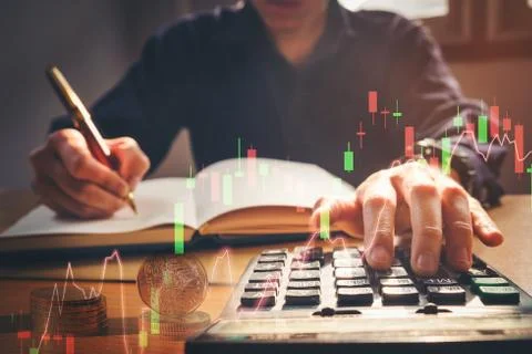 Double exposure business man using calculator and writing business plan at .. Stock Photos
