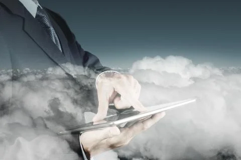 Double exposure of businessman hand using digital tablet with cloud as concep Illustrazione stock