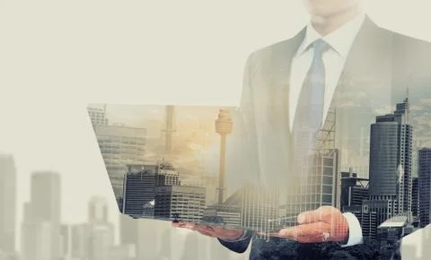 Double exposure of businessman using laptop computer 스톡 일러스트