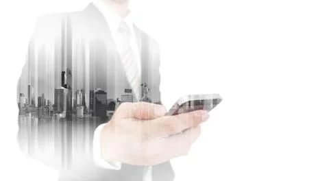 Double exposure businessman using smartphone with city background Stock Photos