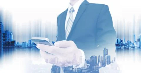 Double exposure businessman using smartphone with panoramic city Stock Photos