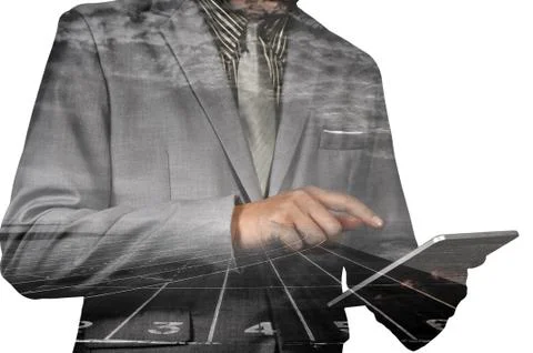 Double exposure of a businessman using a tablet over white background Foto stock