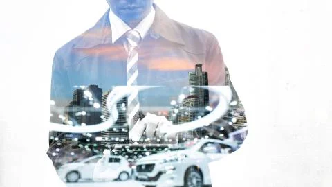 Double exposure of businessman using tablet with car in showroom Stock Photos
