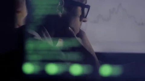 Double exposure: businessman working at computer and checks stock market Stock Footage 69074156