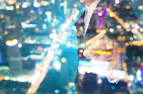 Double exposure of Businessman write on Touch screen with City Bokeh Stock Photos