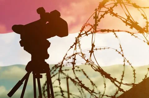 Double exposure - camera, barbed wire and flag Hungary Stock Photos