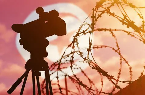 Double exposure - camera, barbed wire and flag Tunisia Stock Photos