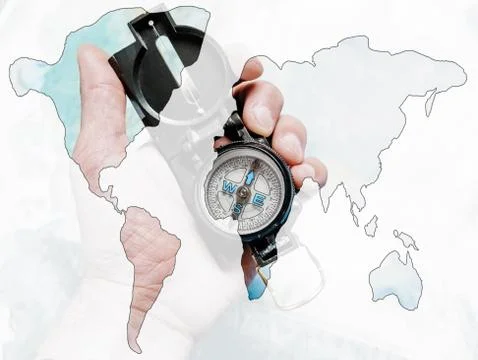 Double exposure of compass with map of world. Stock Photos