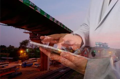 Double exposure of Engineer Man use Mobile Tablet with Sunset scene and Const Stock Photos