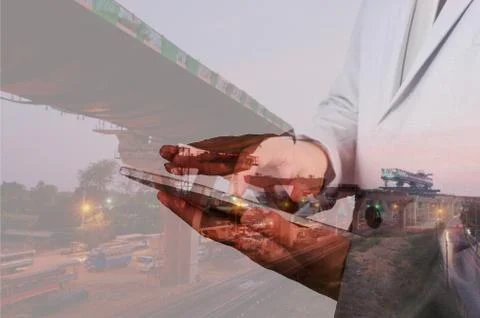 Double exposure of Engineer Man use Mobile Tablet with Sunset scene and Const Stock Photos