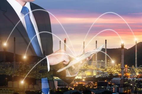 Double exposure of engineer using digital tablet pc assistance control machin Stock Photos