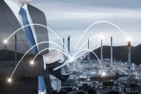 Double exposure of engineer using digital tablet pc assistance control machin Stock Photos