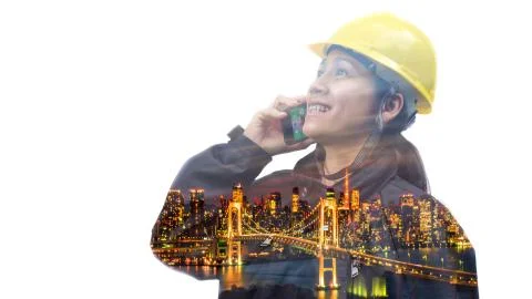 Double exposure engineer using smart phone with traffic light Stock Photos